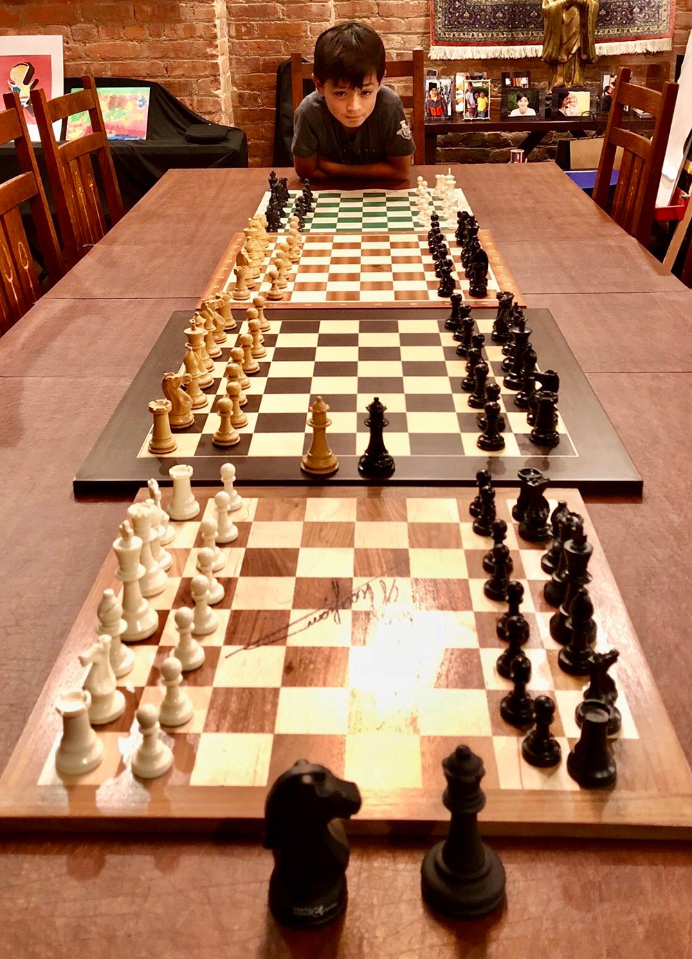 Oliver, at home in New York City, displays his collection of chess boards. His favorites include a board signed by World Chess Champion Garry Kasparov and another autographed by the U.S. Chess Champion Fabiano Caruana. September, 2018